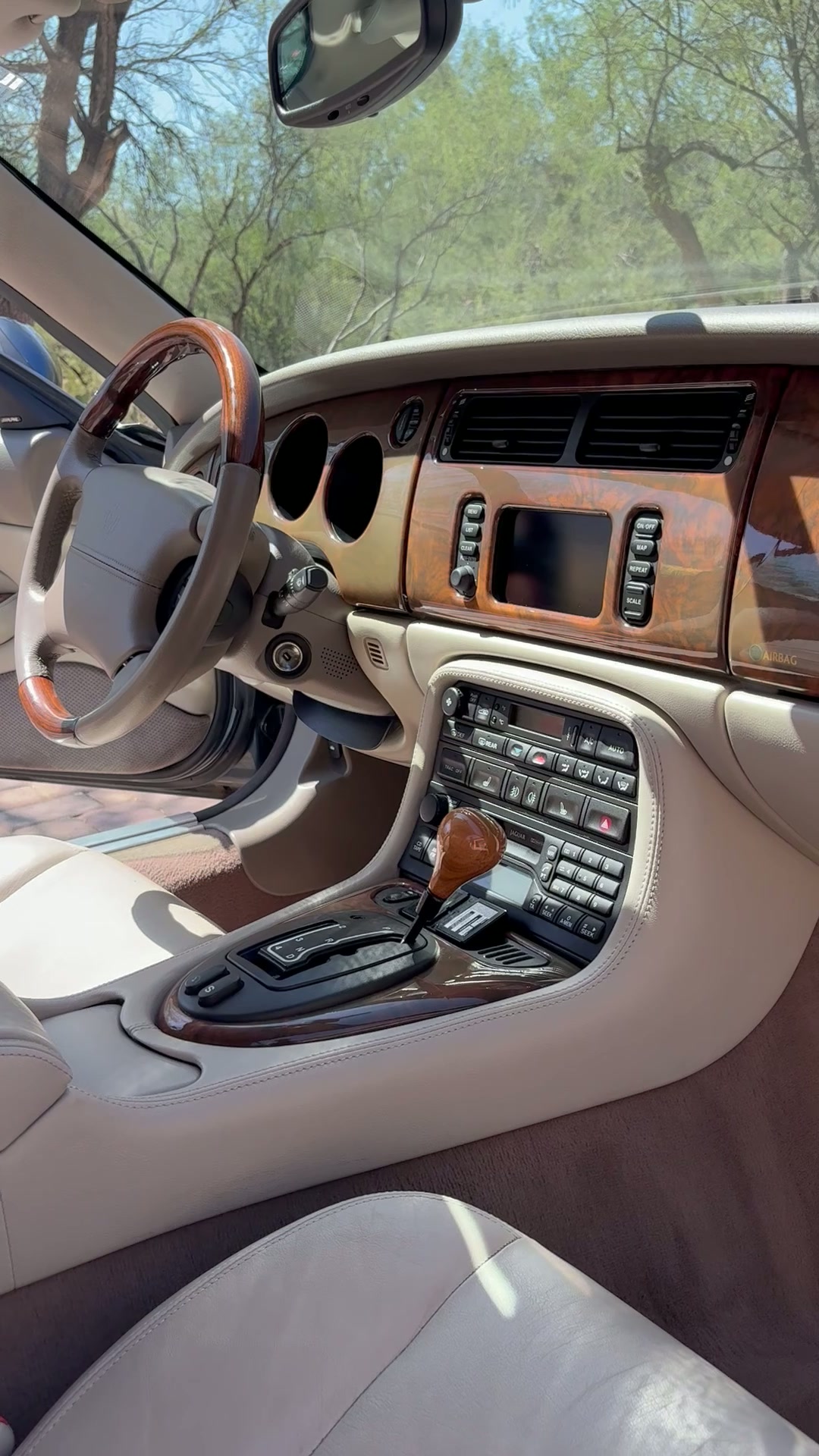 Restored Jaguar XK interior with conditioned wood and leather